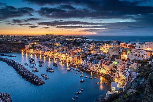 Europe-Italy-Procida-Overview of city and Marina Corricella at sunset Coastal Print